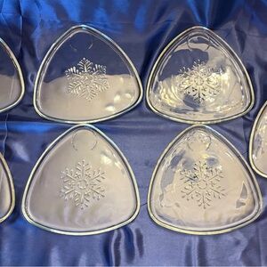 Set of clear glass Indiana Glass Snowflake snack plates with cup holders.
